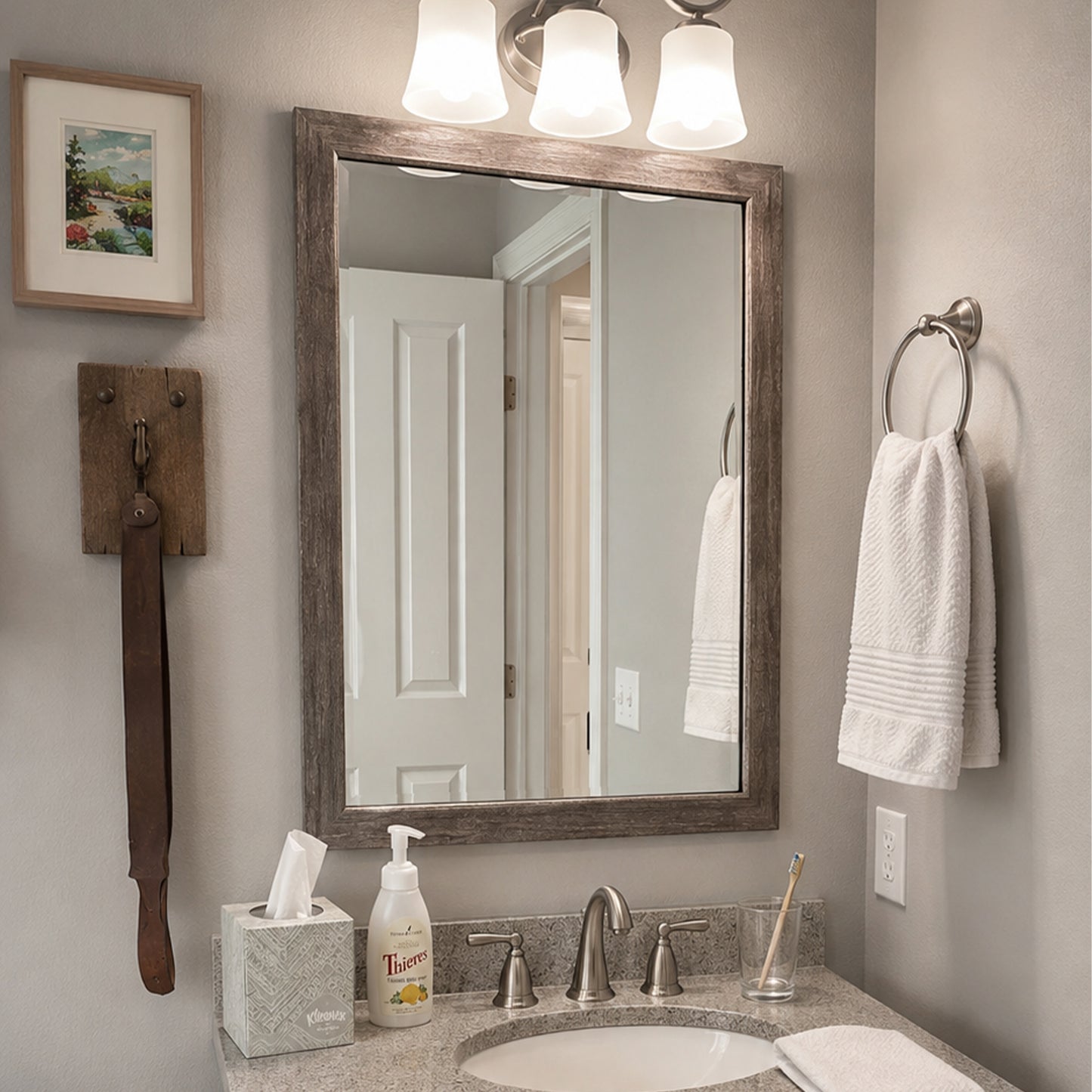 Cherokee Old Vermont Grey MirrorMate frame above a single bathroom vanity in a rustic bathroom