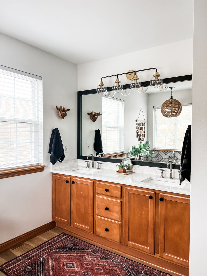 Double Sink Wood Bathroom Vanity with Industrial LED Lights and a Black Framed Mirror by MirrorMate