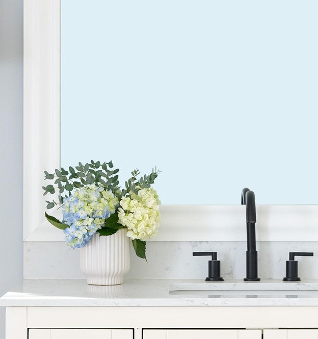 Vanity Bathroom Mirror With a Frame and Flowers