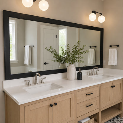 Annandale Black Slim MirrorMate bathroom mirror frame above a light wood double vanity