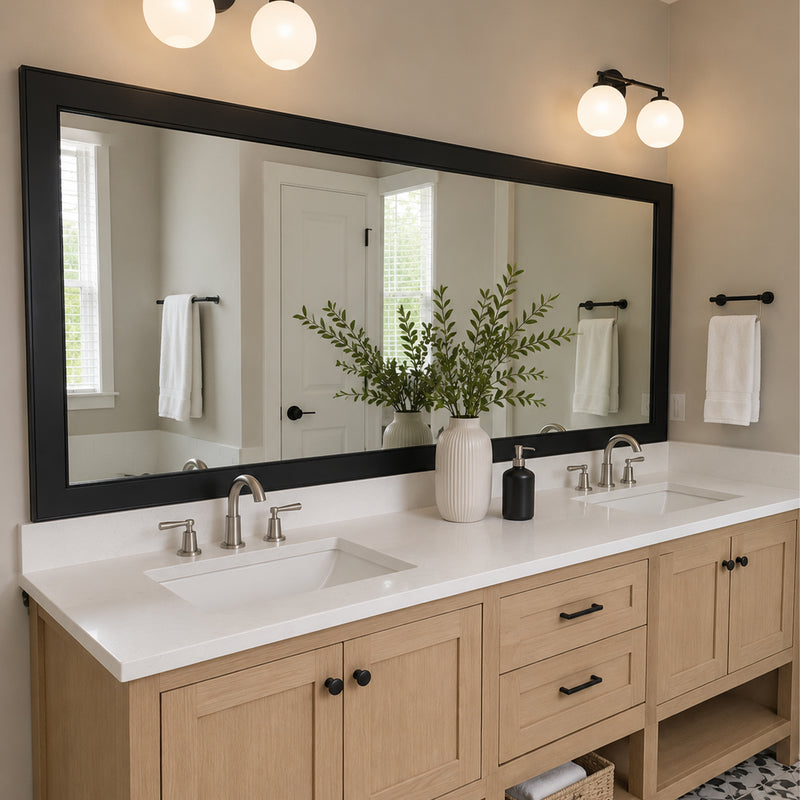 Annandale Black Slim MirrorMate bathroom mirror frame above a light wood double vanity