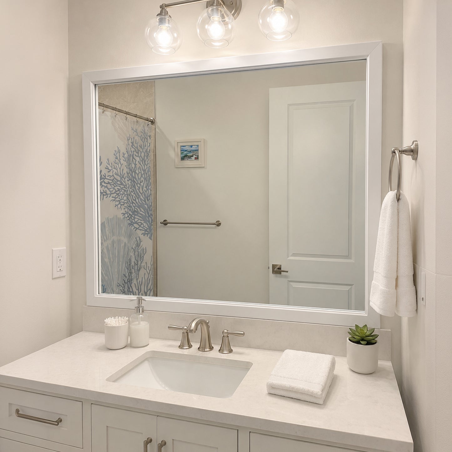 Annandale White Slim MirrorMate frame on a bathroom vanity mirror above a white backsplash