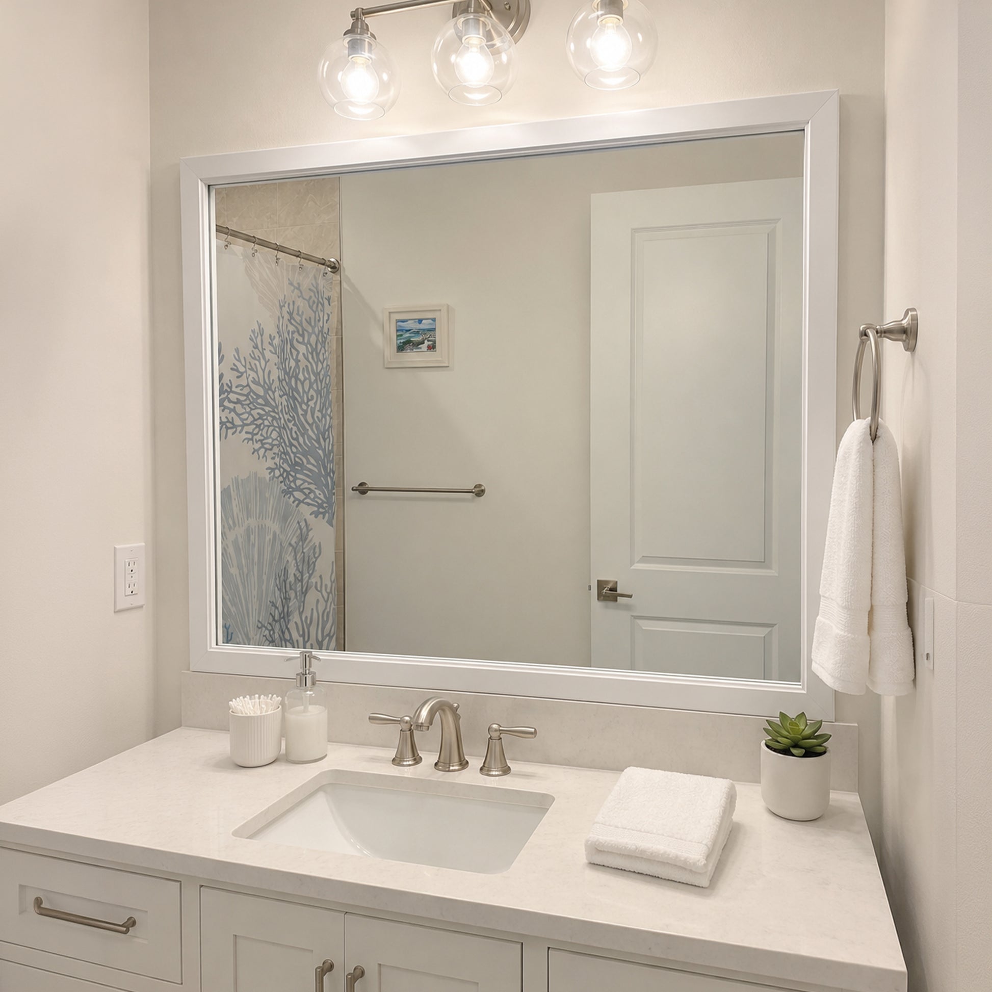 Annandale White Slim MirrorMate frame on a bathroom vanity mirror above a white backsplash