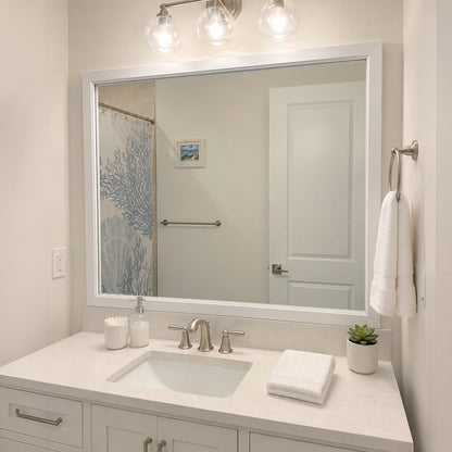 Annandale White Slim MirrorMate frame on a bathroom vanity mirror above a white backsplash