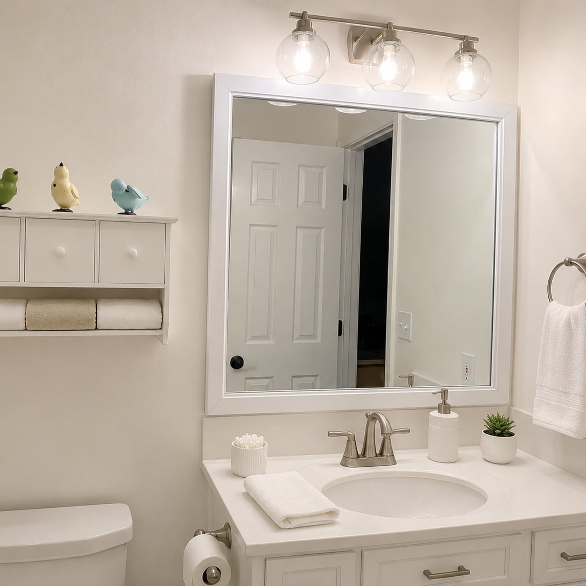 Annandale White Slim MirrorMate frame on a single vanity mirror in a bright white bathroom