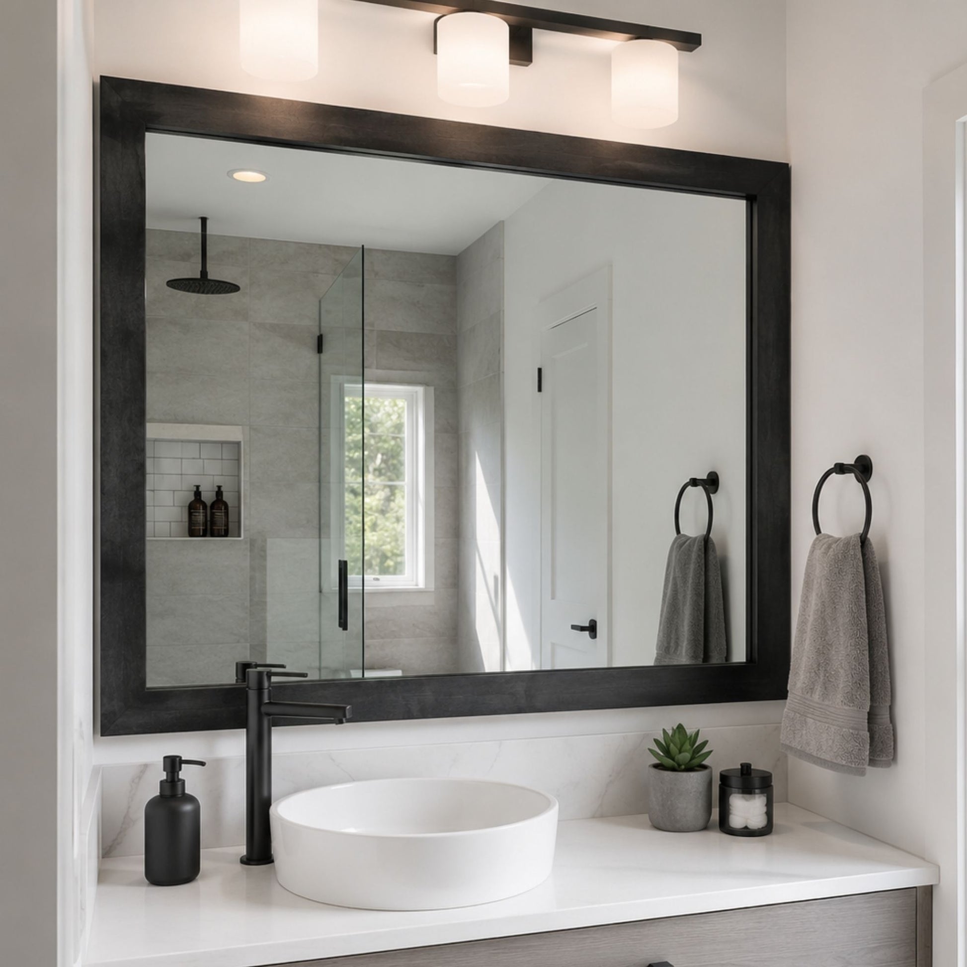 Austin Gunmetal Grey Slim MirrorMate frame on a modern single vanity bathroom mirror