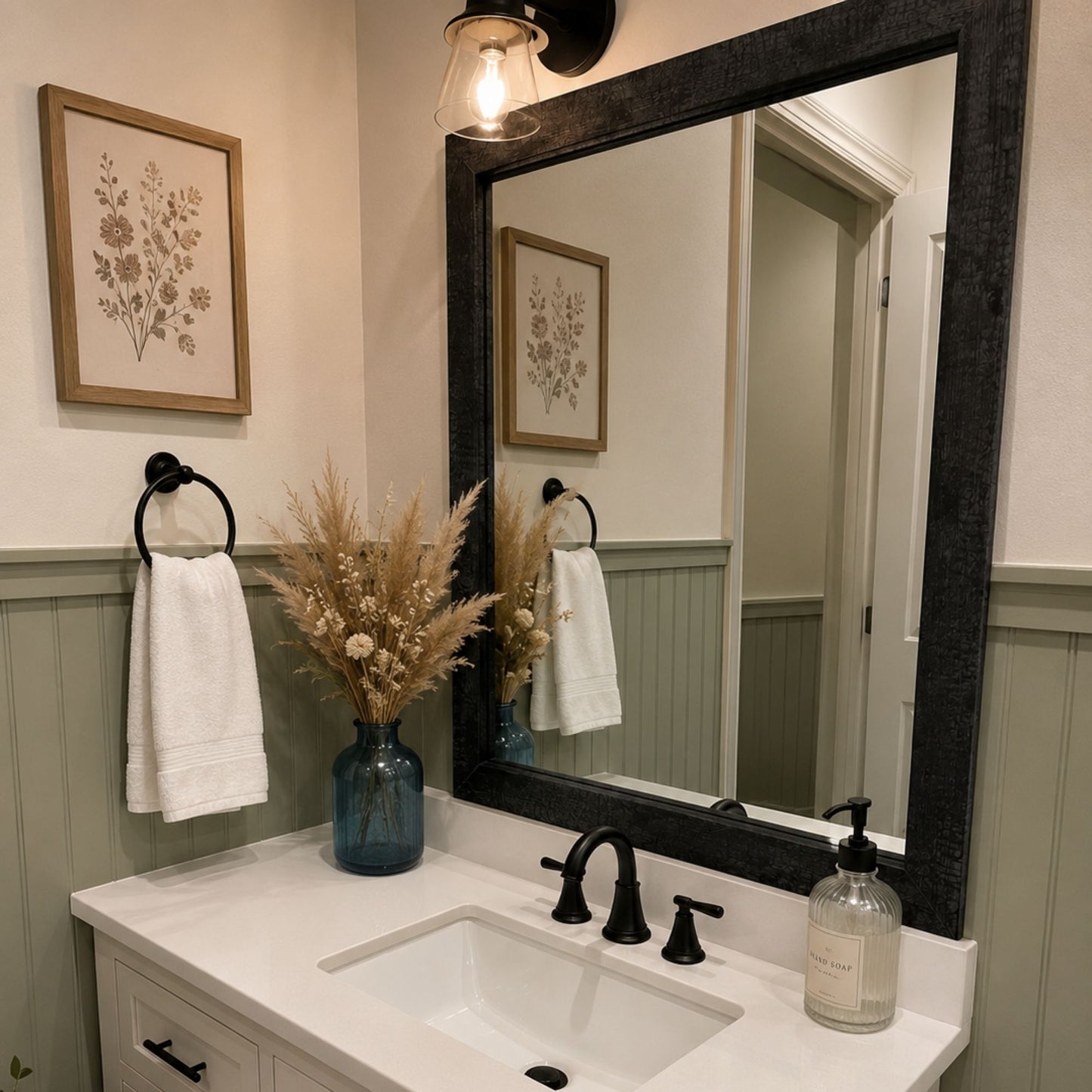 Big Sur Ash Black MirrorMate frame above a single vanity in a sage green modern farmhouse bathroom