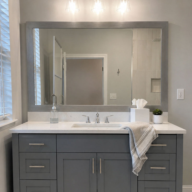 Broadway Brushed Chrome MirrorMate frame above a gray single vanity in a bright contemporary bathroom