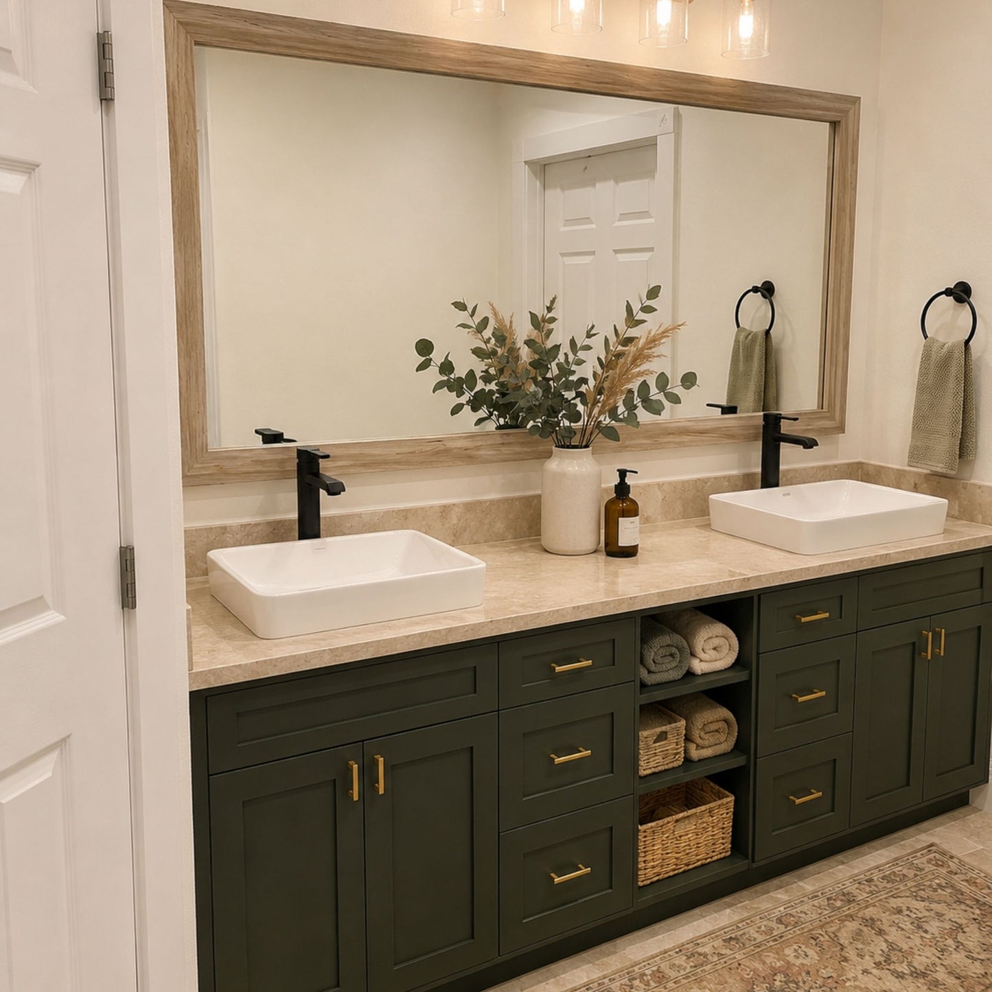Cherokee Montauk Sand MirrorMate frame above a dark green double bathroom vanity