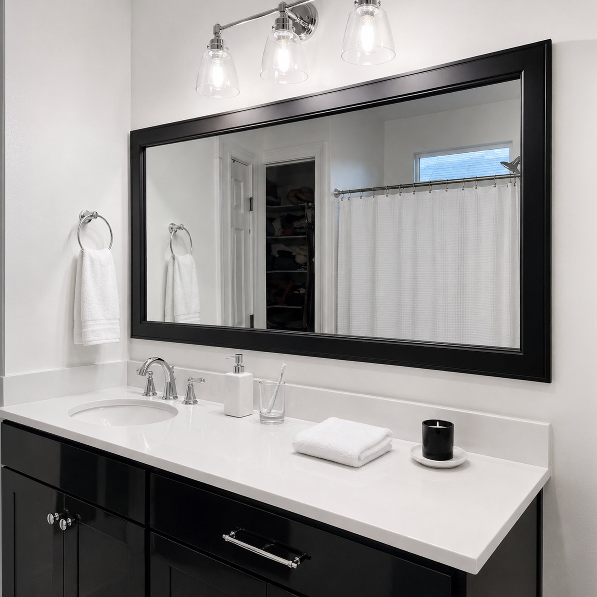 Essex Black Tie MirrorMate frame above a wide black bathroom vanity