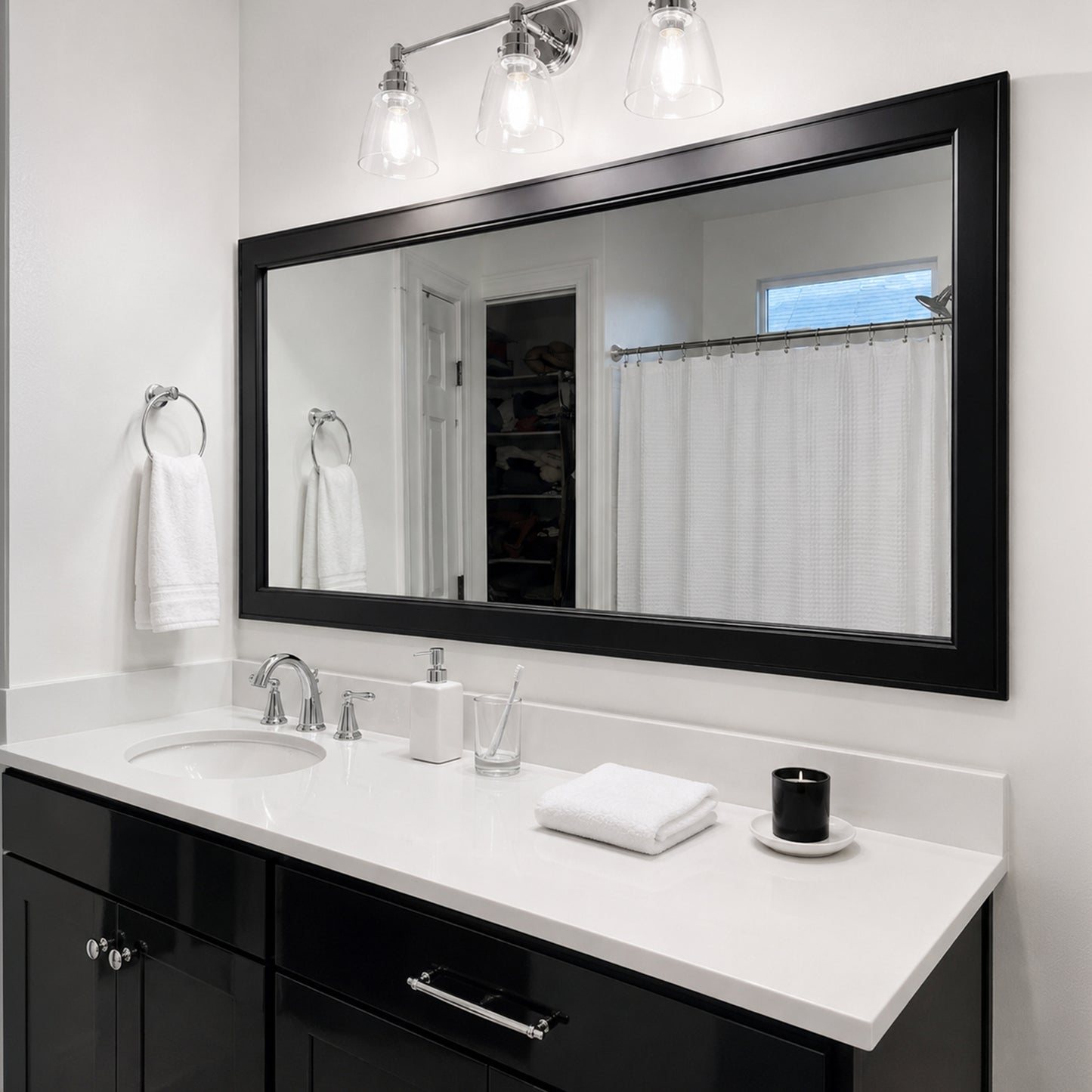 Essex Black Tie MirrorMate frame above a wide black bathroom vanity