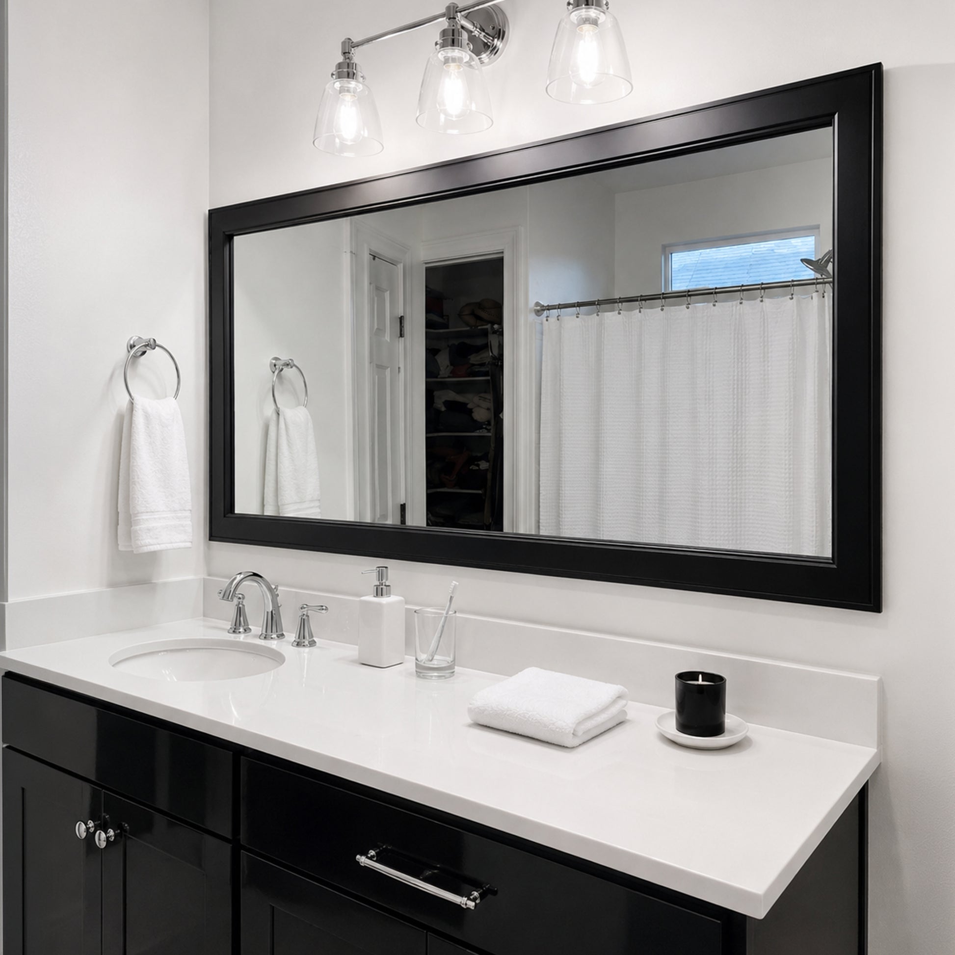 Essex Black Tie MirrorMate frame above a wide black bathroom vanity