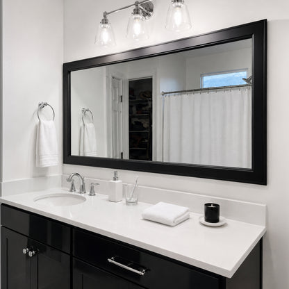 Essex Black Tie MirrorMate frame above a wide black bathroom vanity