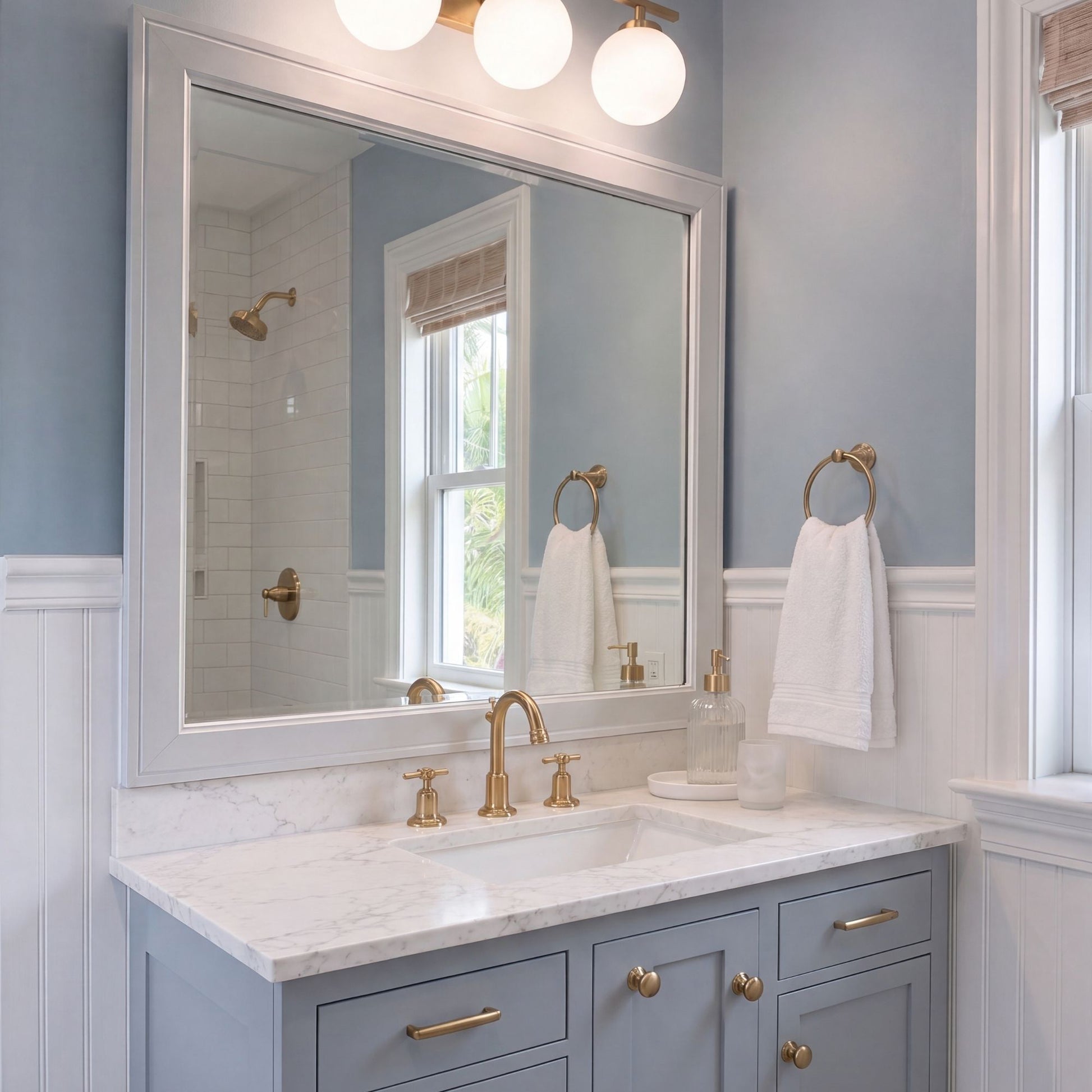 Essex White Satin MirrorMate bathroom mirror frame in a light blue bathroom