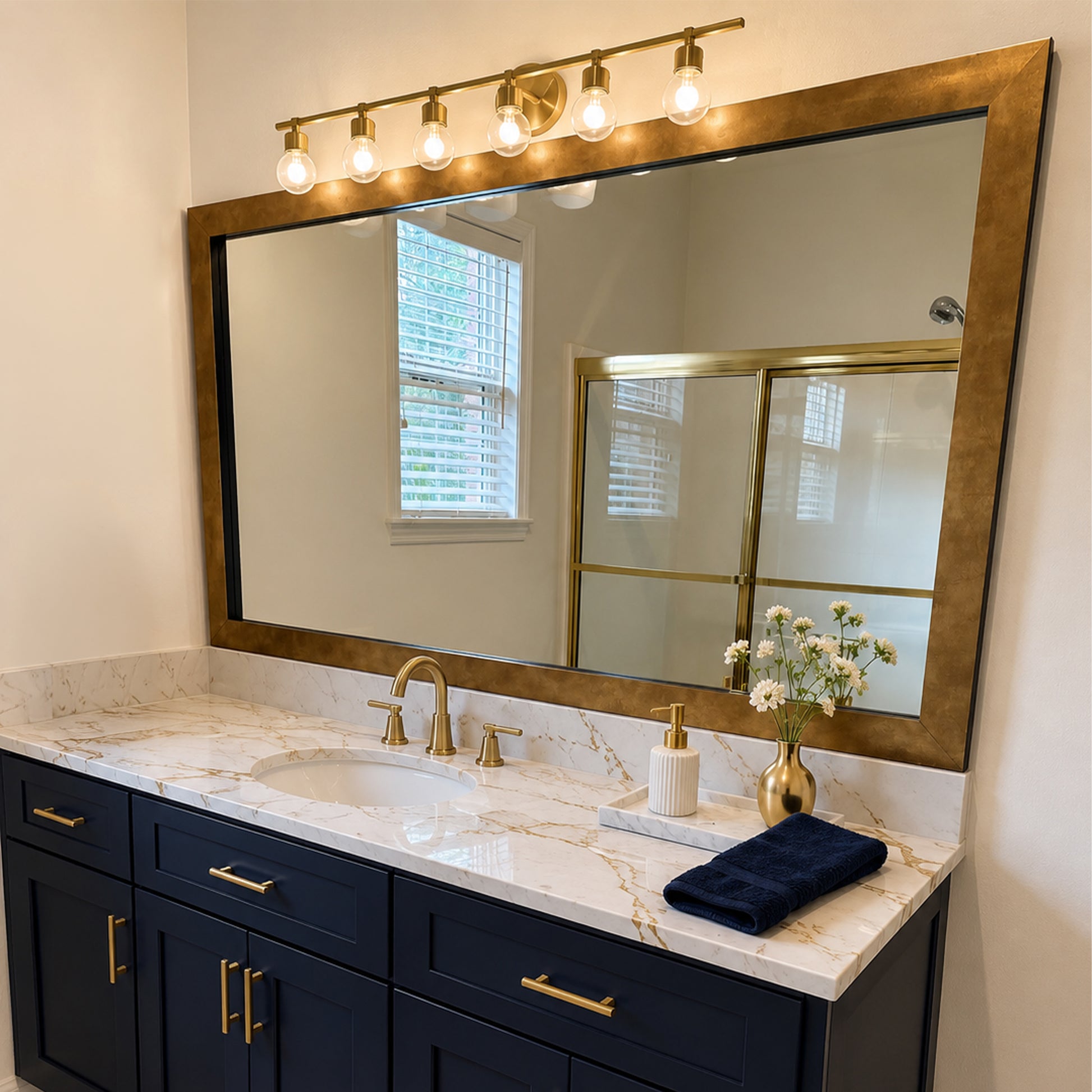 French Quarter Designer Gold MirrorMate frame above a navy single bathroom vanity