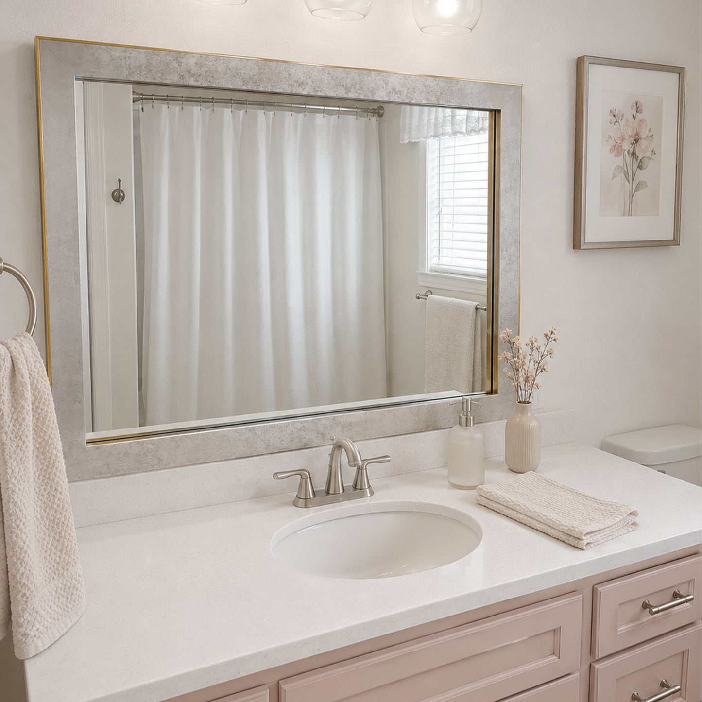 French Quarter Vintage Platinum MirrorMate frame above a blush single bathroom vanity