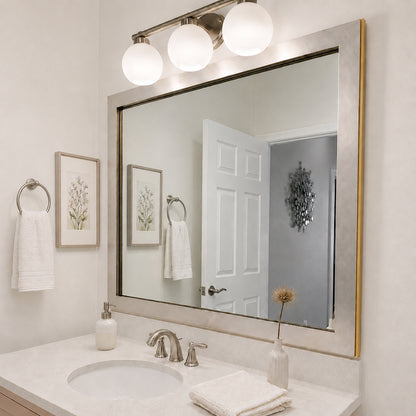 French Quarter Vintage Platinum MirrorMate frame above a white single bathroom vanity