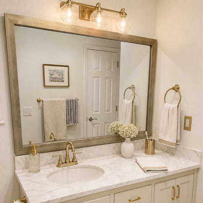 Highline Champagne Gold Slim MirrorMate bathroom mirror frame above a single vanity