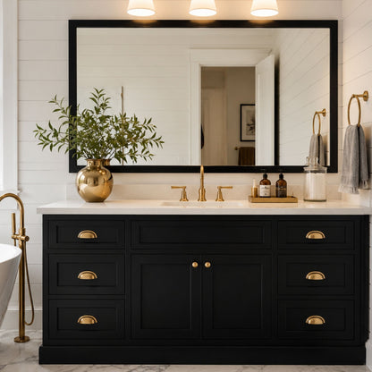 Highline Midnight Black Slim MirrorMate bathroom mirror frame above a black vanity