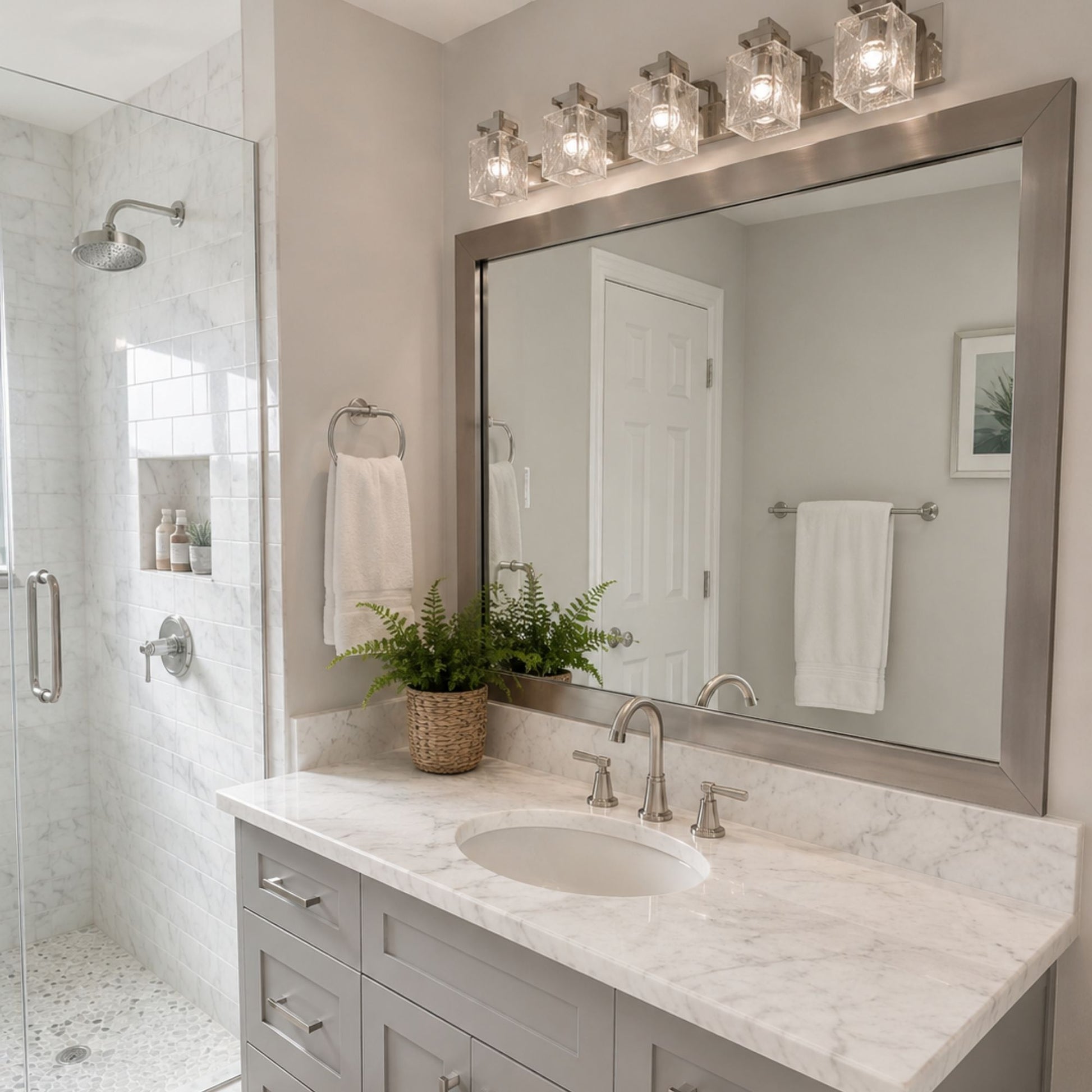 Highline Satin Nickel Slim MirrorMate bathroom mirror frame above a single vanity