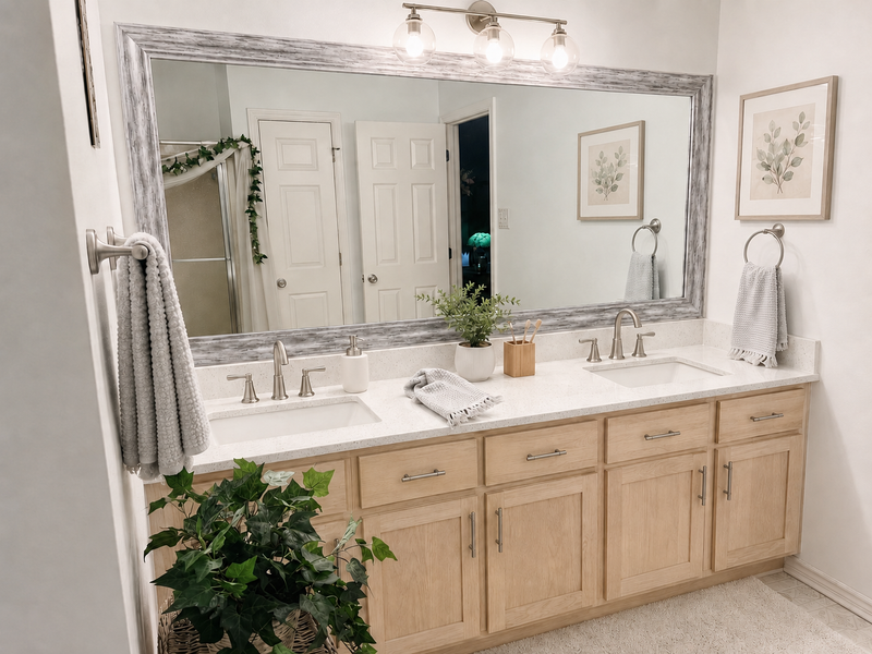 Hudson Silver Birch MirrorMate bathroom mirror frame above a light wood double vanity