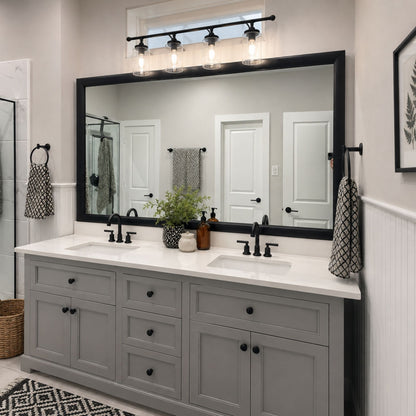 Pemaquid Black Slim MirrorMate bathroom mirror frame above a gray double vanity