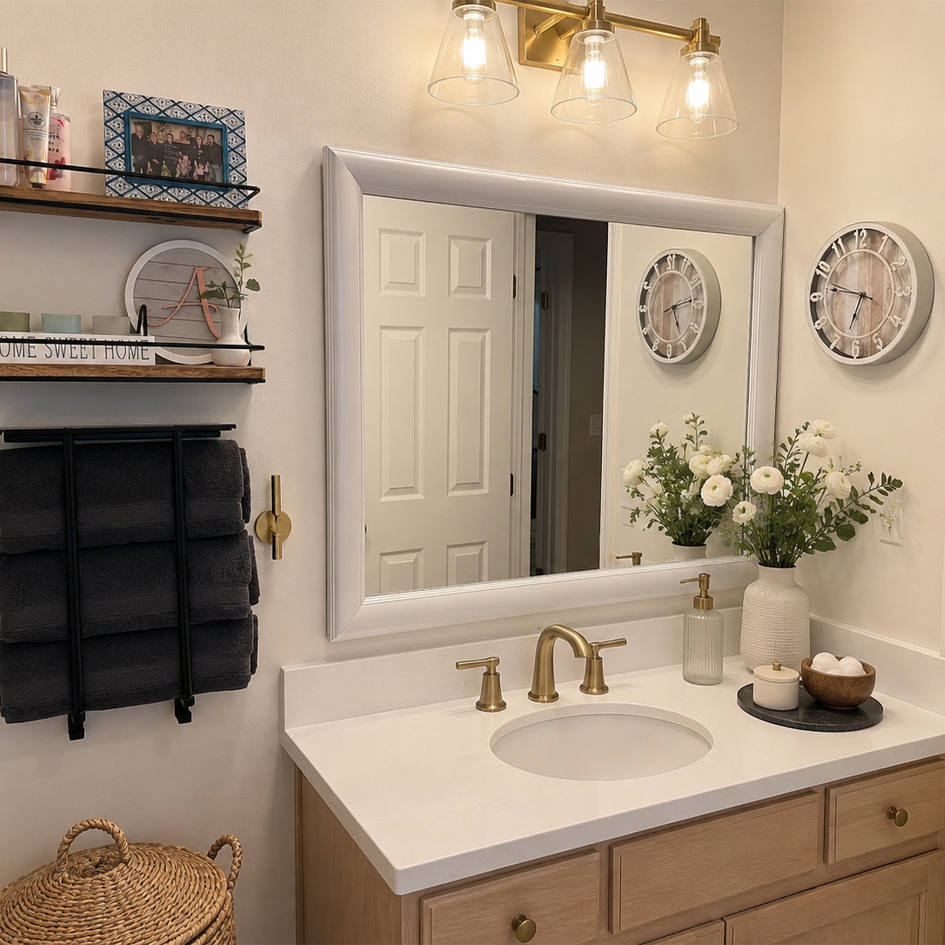 Pemaquid Porcelain White MirrorMate bathroom mirror frame above a light wood single vanity