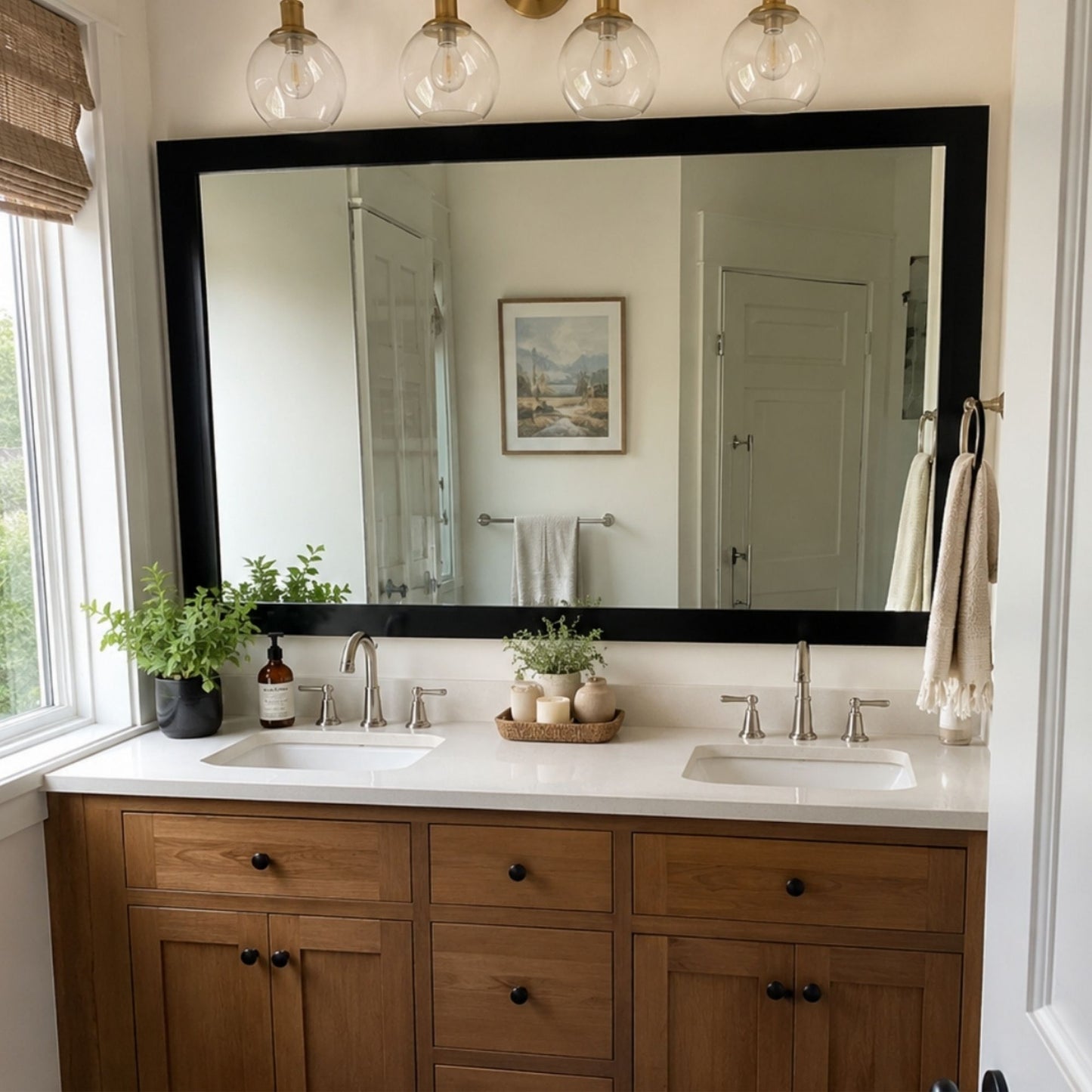 Soho Matte Black MirrorMate bathroom mirror frame above a natural wood double vanity