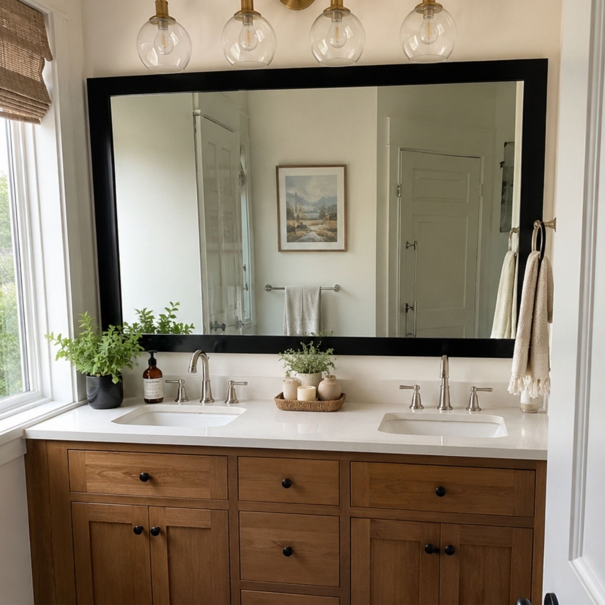 Soho Matte Black MirrorMate bathroom mirror frame above a natural wood double vanity
