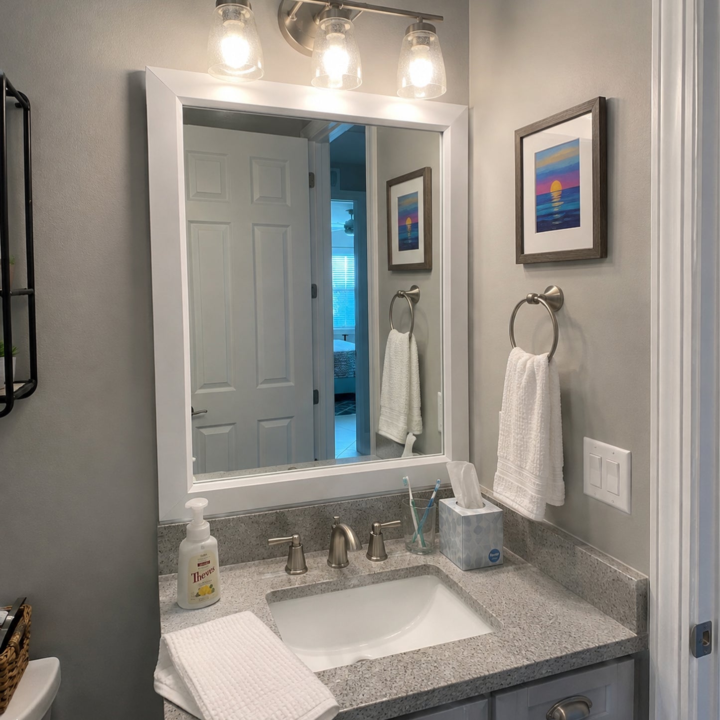 Soho Satin White MirrorMate bathroom mirror frame above a gray single vanity