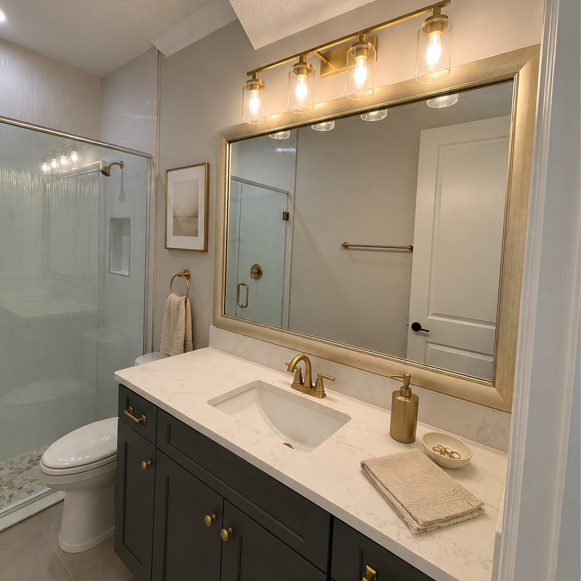 Solana Modern Gold MirrorMate bathroom mirror frame above a dark vanity in a modern bathroom