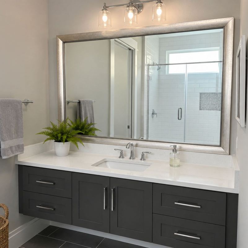 Solana Modern Silver MirrorMate bathroom mirror frame above a dark gray single vanity